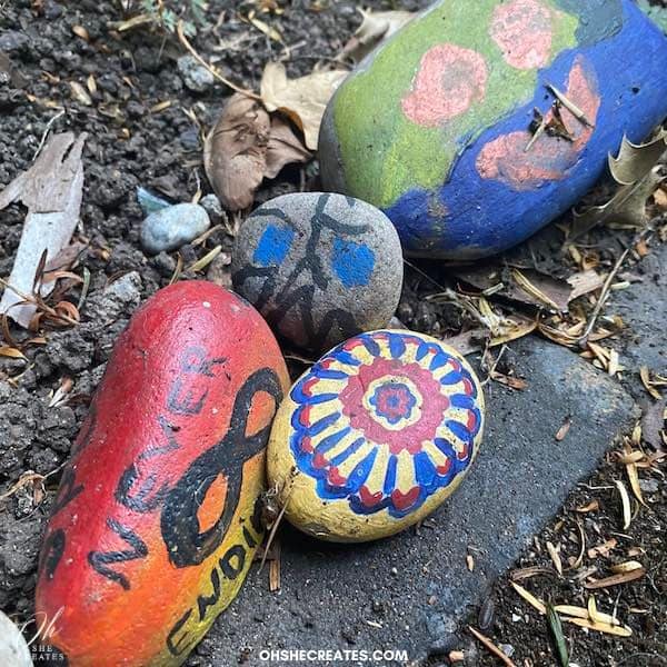rocks painted with peace sign